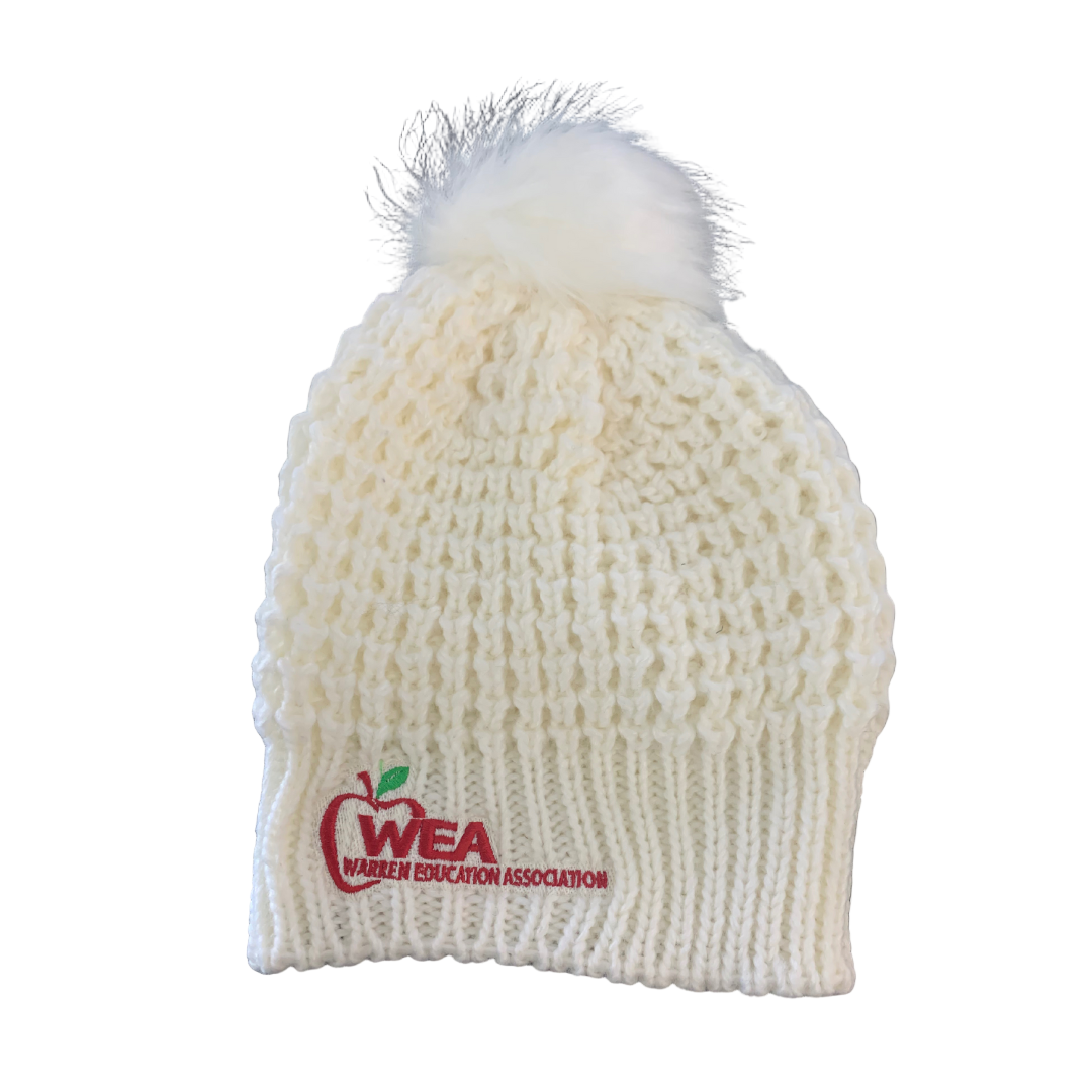 White knit beanie with pom-pom and WEA logo on a white background